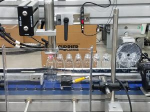 PET Bottles going through vision and leak test systems