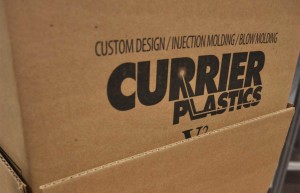 photo of cardboard container with Currier logo