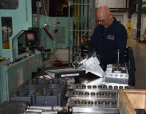 Blow Molding Engineer preparing an ISBM mold for installation.